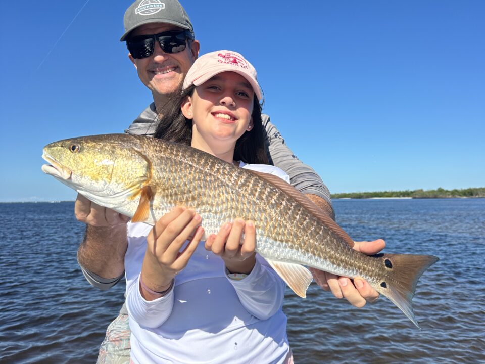 A solid redfish caught by this young lady while fishing in Boca Grande with her dad.