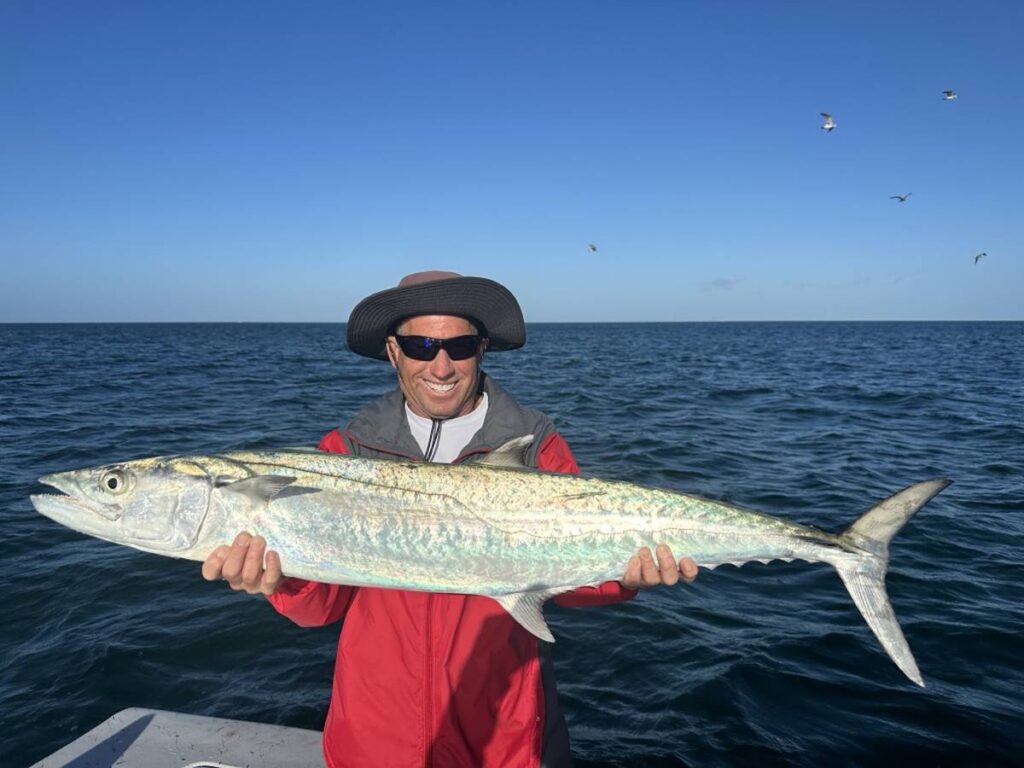 Nearshore Kingfish β ReelFishing Charters Boca Grande & Punta Gorda Angler holding a large Kingfish during a nearshore fishing charter off Boca Grande and Punta Gorda with ReelFishing Charters.