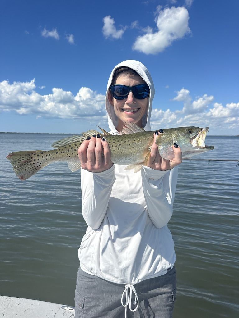 January 2026 spotted seatrout Charlotte Harbor fishing charter Angler holding a spotted seatrout caught during a January fishing charter in Charlotte Harbor with ReelFishing Charters