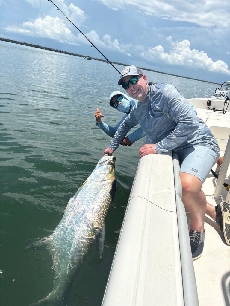 Boca Grande Tarpon Release – April 2026 Tarpon being released boatside during Boca Grande tarpon fishing in April